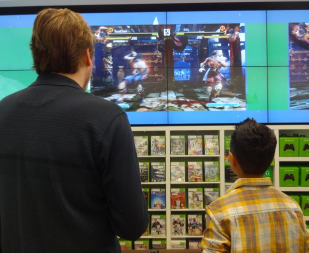 Gamers trying out the new Xbox One at the Jacksonville Microsoft Store grand opening.